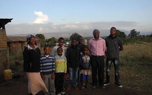 Yosef Njogu and Ruth with seven of their 13 children. They are the biggest family and make up about a quarter of the entire Jewish community in Kasuku. (Melanie Lidman/Times of Israel)