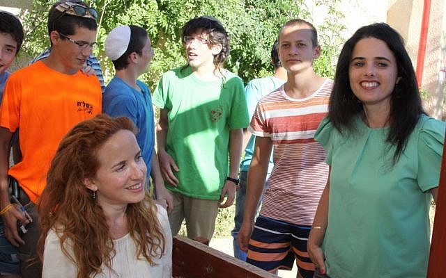 MKs Stav Shaffir (Labor) and Ayelet Shaked (Jewish Home) speak to students of the Mekor Chaim yeshiva in the Etzion Bloc,  June 25, 2014. Three teenage students, two of them from the yeshiva, who were missing at the time, were found dead days later, killed by Palestinian terrorists. (Photo credit: Gershon Elinson/FLASH90)