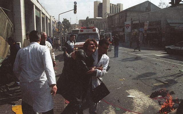 A woman is evacuated for medical treatment after a female suicide bomber blew herself up in the center of Jerusalem, January 27, 2002. (Flash90)
