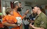 Settler in the Gaza Strip settlement of Netzarim argues with soldiers who have come to evacuate him from his home, accusing them of betraying Jewish values, during the disengagement from Gaza, August 22, 2005. (Flash90)