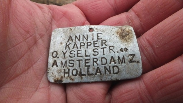 A metal plate bearing the name of 13-year-old Annie Kapper from Amsterdam was found at the Sobibor death camp in eastern Poland in 2013. (Courtesy of Yoram Haimi/JTA)