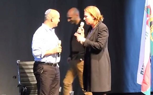 Jewish Home leader Naftali Bennett and Hatnua head Tzipi Livni, of the Zionist Camp, spar over giving up land for peace in this screen grab from a video uploaded February 1, 2015 . (Photo credit: screenshot/YouTube)