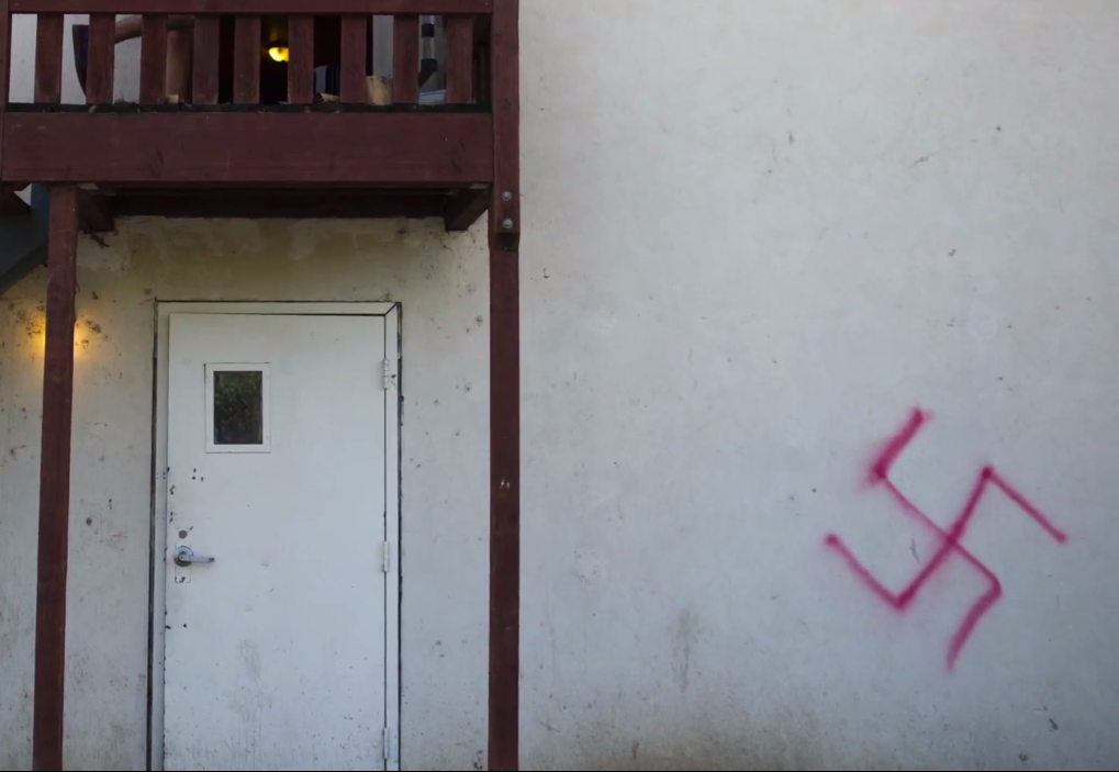 One of the two swastikas spray painted outside a Jewish fraternity at the University of California, Davis on Jan. 31, 2015. One was spray painted on their back wall and the other on their steps. (Screen capture: Sacramento Bee)