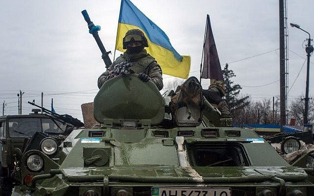 Ukrainian soldiers ride armored vehicles to Debaltseve, eastern Ukraine, Donetsk region, on February 1, 2015. (AFP/Oleksander Stashevsky)