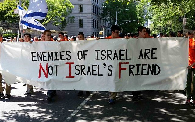 Students from the Rambam Mesivta Jewish day school in Lawrence, NY, march in the 2014 Celebrate Israel Parade, holding a sign stating, Enemies of Israel are Not Israel's Friends,' June 1, 2014. (Rabbi Yotav Eliach/courtesy of Im Tirtzu)