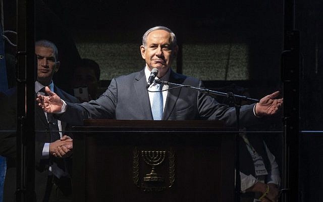 Prime Minister Benjamin Netanyahu speaks during a campaign rally in Rabin Square, Tel Aviv, on March 15, 2015. (photo credit: AFP/Jack Guez)