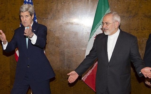 Secretary of State John Kerry, left, and Iranian Foreign Minister Mohammad Javad Zarif prepare to take their seats for a new round of nuclear negotiations in Montreux, Switzerland on March 2, 2015.  (photo credit: AFP/POOL /EVAN VUCCI)