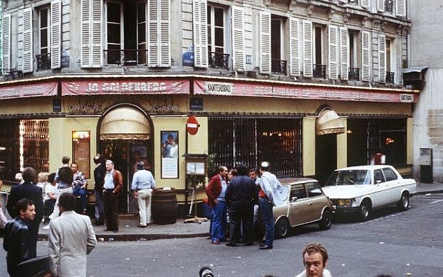 This file picture dated August 11, 1982, shows people standing in front of the Chez Jo Goldenberg restaurant in Paris, two days after it was devastated in an attack by Palestinian gunmen (AFP/ JOEL ROBINE)
