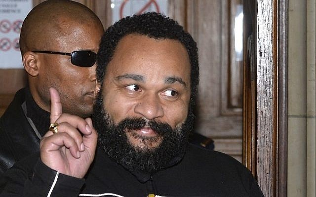 French comedian Dieudonne gesturing as he leaves his trial at the courthouse in Paris, France, February 4, 2015. (photo credit: AFP/Miguel Medina, File)