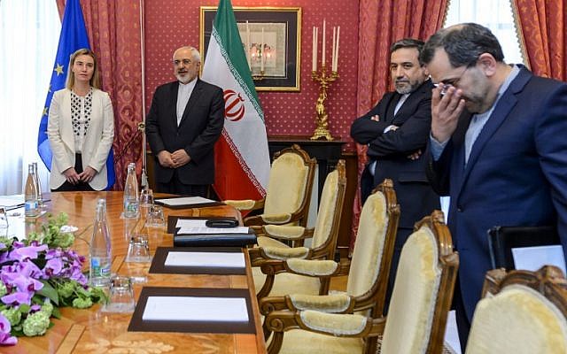 EU Foreign Policy Chief Federica Mogherini (left) meets Iranian Foreign Minister Mohammad Javad Zarif (2nd left) and Iranian Deputy Foreign Minister Abbas Araqchi (2nd right) during Iranian nuclear talks in Lausanne, Switzerland, on March 29, 2015. (AFP/Fabrice Coffrini)