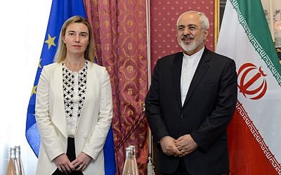 EU foreign policy chief Federica Mogherini (L) meets with Iranian Foreign Minister Mohammad Javad Zarif during Iranian nuclear talks in Lausanne on March 29, 2015. Global powers are seeking to pin down the broad outlines of a deal to rein in Iran's suspect nuclear program by a March 31 deadline. (photo credit: AFP PHOTO / FABRICE COFFRINI)