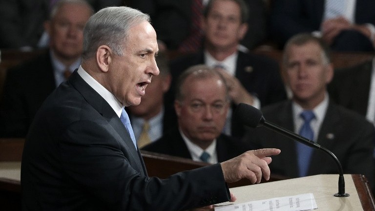 Prime Minister Benjamin Netanyahu addresses a joint meeting of the United States Congress in the House chamber at the US Capitol in Washington, DC on Tuesday, March 3, 2015, in a speech warning against the then-looming US-backed deal with Iran (Win McNamee/Getty Images/AFP)