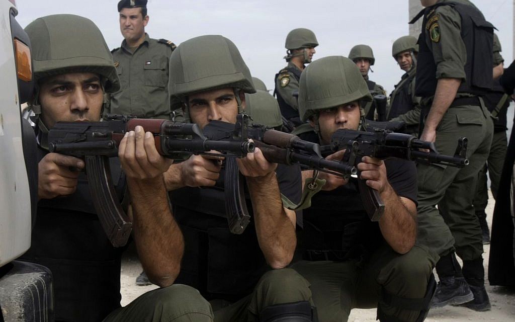 Palestinian security forces participate in a training exercise in the West Bank city of Tulkarem, November 23, 2013. (AP/Nasser Ishtayeh)