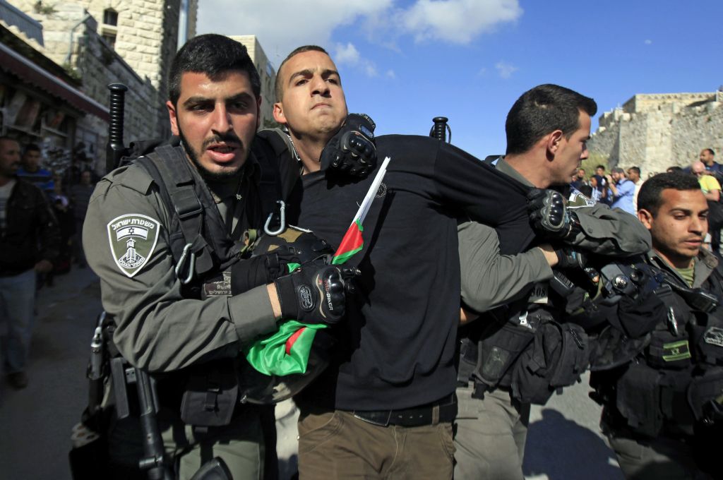 Israeli border policemen detain a Palestinian protester during a protest marking Land Day in Jerusalem's Old City, Monday, March 30, 2015 (photo credit: AP/Mahmoud Illean)
