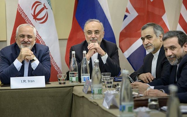 Iranian Foreign Minister Javad Zarif, left, Head of Iranian Atomic Energy Organization Ali Akbar Salehi, second left, Special Assistant to Iranian president Hossein Fereydoun, second right, and Iranian Deputy Foreign Minister Abbas Araghchi wait for the start of a meeting with Britain, Russia, China, France, Germany, European Union and the U.S. officials at the Beau Rivage Palace Hotel in Lausanne, Switzerland Monday, March 30, 2015, during Iran nuclear talks (AP Photo/Brendan Smialowski, Pool)