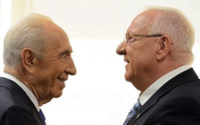 President Reuven Rivlin speaks with outgoing president, Shimon Peres, after being sworn in as the tenth president of Israel in a ceremony at the Knesset Plenum on Thursday, July 24, 2014. Photo credit: Haim Zach/GPO/Flash90)