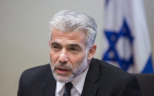 Chairman of the Yesh Atid Party, Yair Lapid, speaks during the Yesh Atid faction meeting at the Knesset, on October 27, 2014. (Photo credit: Yonatan Sindel/Flash90)