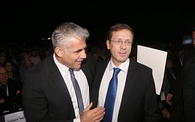 Yesh Atid party leader Yair Lapid (L) and Zionist Union party leader Isaac Herzog on December 24, 2014. (photo credit: Flash90)