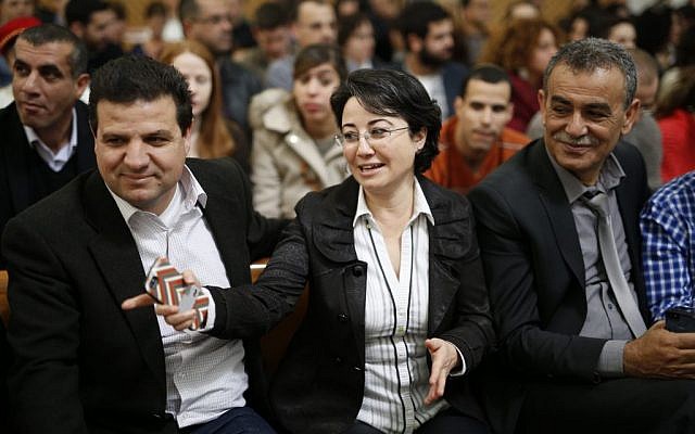 Arab-Israeli parliament member Hanin Zoabi accompanied by Ayman Odeh (L) and MK Jamal Zahalka seen in the Supreme Court in Jerusalem where she appealed a decision by the Central Election Committee to disqualify her from running in the upcoming Israeli elections, February 17, 2015 (David Vaaknin/Flash90)