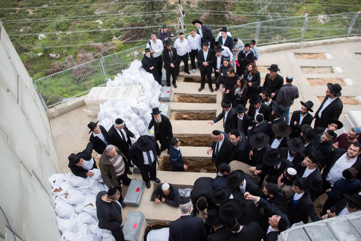 Mourners attend the funeral of the seven children from the Sassoon family in Jerusalem on March 23, 2015. (photo credit: Yonatan Sindel/Flash90)