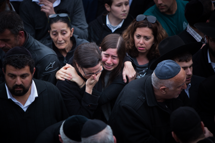 Mourners attend the funeral of the seven children from the Sassoon family in Jerusalem on March 23, 2015. (photo credit: Yonatan Sindel/Flash90) 