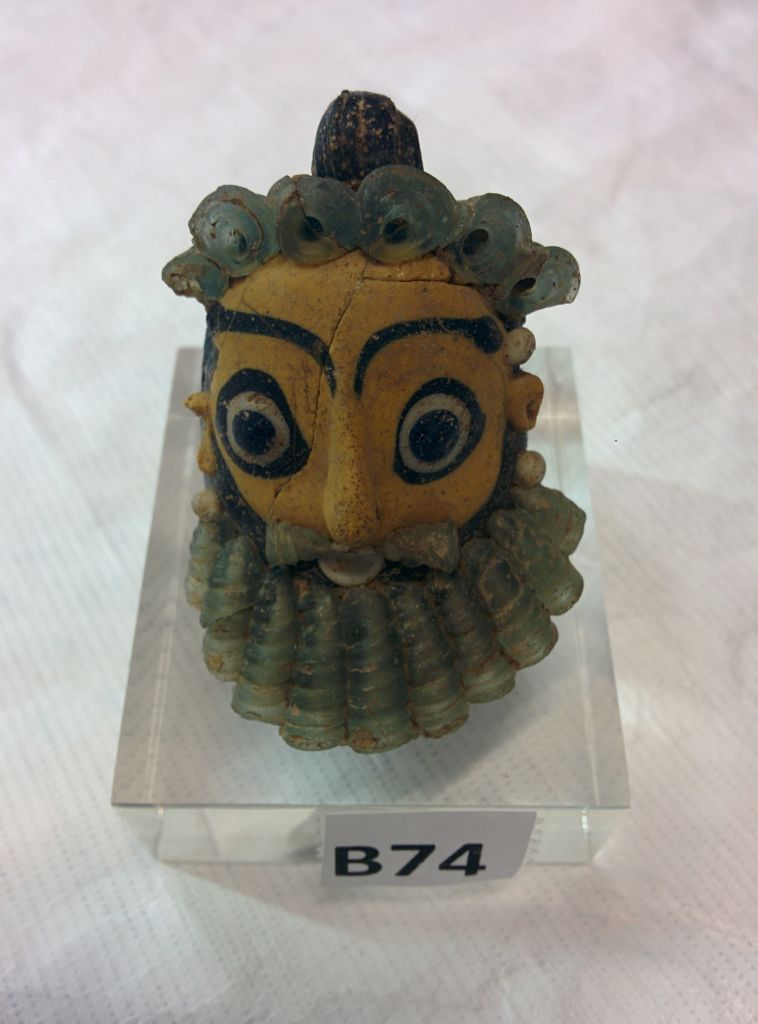 A Punic head pendant, part of the Belfer Collection going on display at the Israel Museum in June. (photo credit: Ilan Ben Zion/Times of Israel staff)