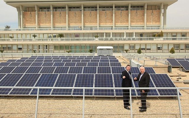 Knesset Speaker Yuli Edelstein (left) and Dir.-Gen. Ronen Flut are seen in front of a solar field outside the Knesset, on Sunday, March 29, 2015. (photo credit: Courtesy Knesset)