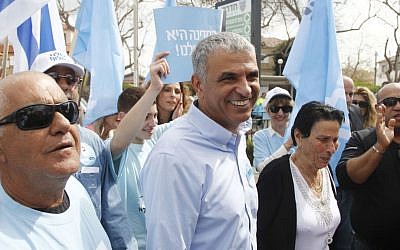 Moshe Kahlon, head of the Kulanu party, returns to his hometown of Givat Olga Tuesday Mar. 17, 2015 to accompany his mother to the voting booth. (Photo credit: Judah Ari Gross/Times of Israel)