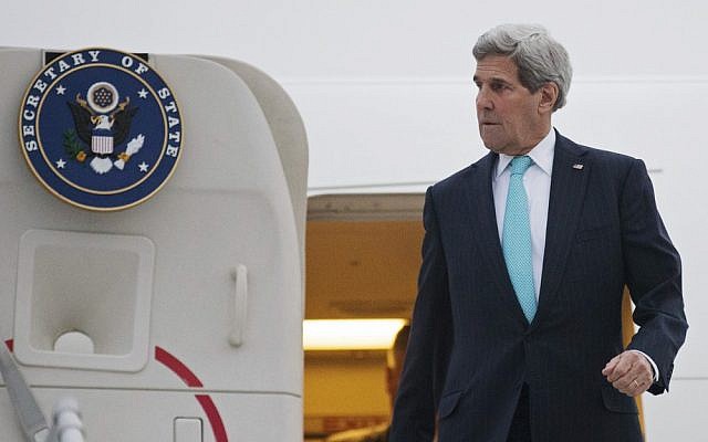 US Secretary of State John Kerry disembarks from his plane as he arrives in Geneva, Switzerland, Sunday March 15, 2015 (AP Photo/Brian Snyder, pool)