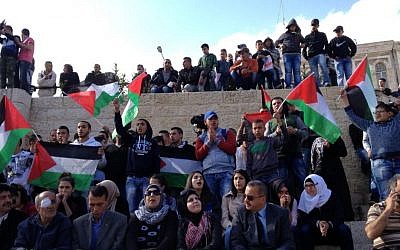 Palestinians singing nationalistic songs near Damascus Gate in the Old City of Jerusalem on Land Day, March 30, 2015. (Elhanan Miller)
