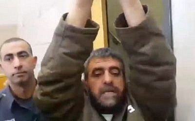 Sidqi al-Maqt, 48, arrested for spying for Syria, raises his arms as he speaks to reporters, March 27, 2015 (screen capture: Channel 2)