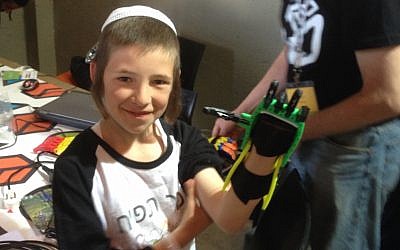 A young TOM participant shows off his Raptor Hand (Photo credit: Courtesy)