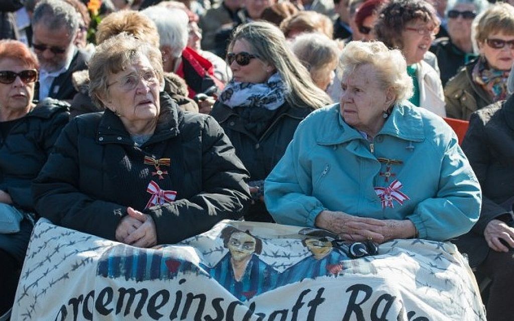 Ilse Heinrich (L) and Charlotte Kroll, survivors of the Ravensbruck Nazi concentration camp, attend an event to commemorate the 70th anniversary of the camp's liberation, on April 19, 2015 in Ravensbrück near Fuerstenberg, northeastern Germany. (AFP PHOTO/DPA/PATRICK PLEU)