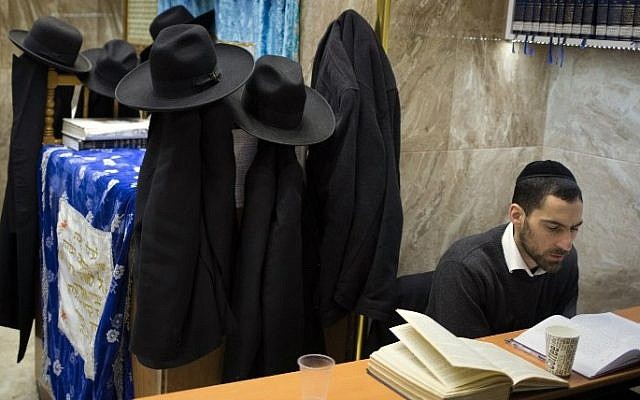 An ultra-Orthodox Jewish student studies the Torah at a synagogue in the Mea Shearim neighborhood of Jerusalem, April 15, 2015. (AFP/MENAHEM KAHANA)
