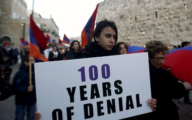 Members of the Armenian community march with flags and torches on April 23, 2015, in Jerusalem's Old City, on the eve of the 100th anniversary of the mass killings of Armenians under the Ottoman Empire in 1915. (AFP/Gali Tibbon)