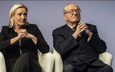 France's former far-right National Front party leader Jean-Marie Le Pen (R) and his daughter and current party leader Marine Le Pen (L) on November 29, 2014 (Photo credit: Jeff Pachoud/AFP)