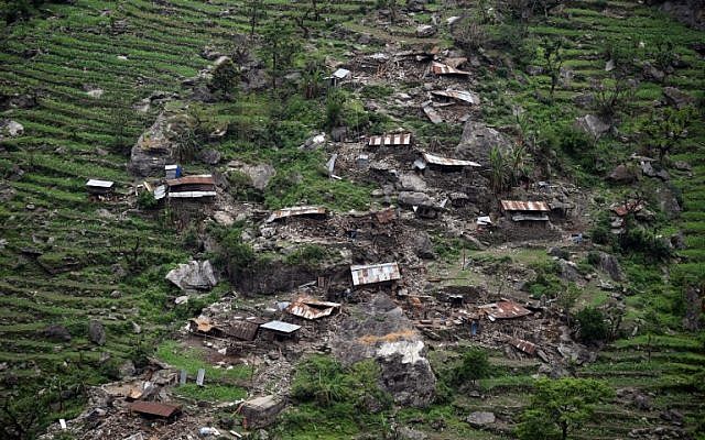 Damaged houses are seen from an Indian Army helicopter following an earthquake in the Nepalese area of Gorkha on April 28, 2015. (photo credit: AFP/Sajjad Hussain)