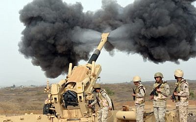 Saudi army artillery fire shells towards Yemen from a post close to the Saudi-Yemeni border, in southwestern Saudi Arabia, on April 13, 2015. (photo credit: AFP / FAYEZ NURELDINE)