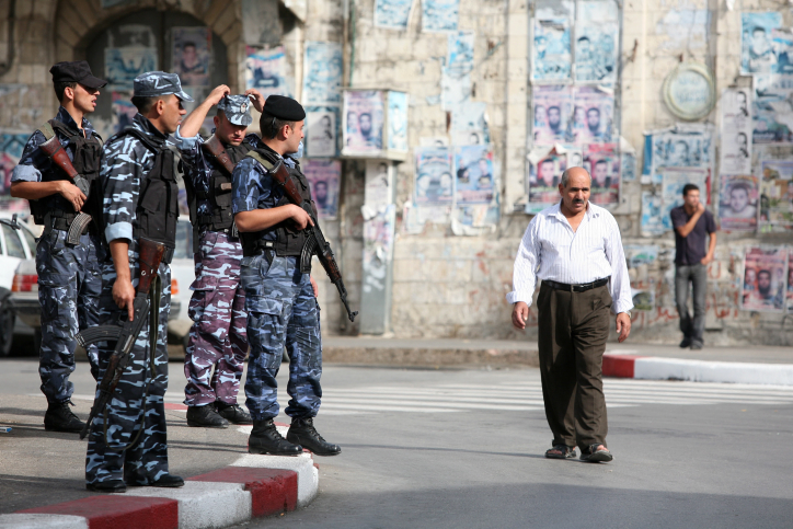 Armed Palestinian police take up positions near the old marketplace in the West Bank city of Nablus in November 2007. (photo credit: Maya Levin / Flash90) 
