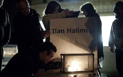 Family and friends attend a memorial ceremony by the grave of 23-year-old Ilan Halimi, at the Givat Shaul cemetery in Jerusalem, February 13, 2013. (photo credit: Tali Mayer/FLASH90)