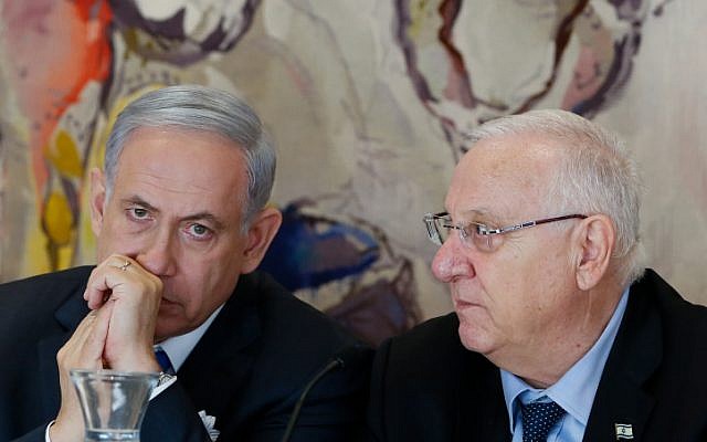 Prime Minister Benjamin Netanyahu (left) seen with President Reuven Rivlin (right) at the opening session of the 20th Knesset, March 31, 2015. (Miriam Alster/Flash90)