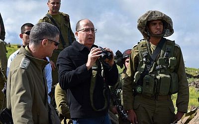 Defense Minister Moshe Ya'alon seen during an army exercise of the IDF Kfir Brigade, in the Golan Heights in northern Israel, April 2, 2015. (photo credit: Ariel Hermoni/Ministry of Defense)