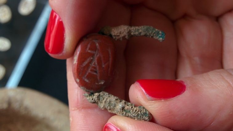 A carnelian signet ring found by IAA archaeologists in a cave near Tel Halif, in southern Israel (photo credit: Ilan Ben Zion/Times of Israel staff)