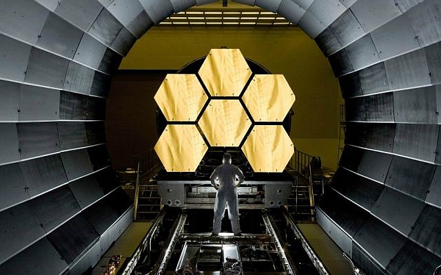 NASA engineer Ernie Wright looks on as the first six flight ready James Webb Space Telescope's primary mirror segments are prepped to begin final cryogenic testing at NASA's Marshall Space Flight Center. (NASA/MSFC/David Higginbotham/Wikipedia)