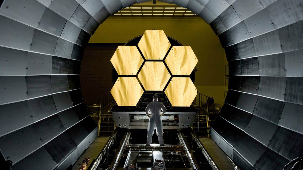 NASA engineer Ernie Wright looks on as the first six flight ready James Webb Space Telescope's primary mirror segments are prepped to begin final cryogenic testing at NASA's Marshall Space Flight Center. (NASA/MSFC/David Higginbotham/Wikipedia)
