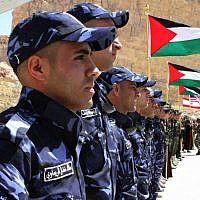 Members of the Palestinian special police forces wait to compete during the 7th Annual International Warrior Competition hosted by the King Abdullah Special Operations Training Center (KASOTC), Sunday, April 19, 2015, Amman, Jordan. (AP Photo/Raad Adayleh)