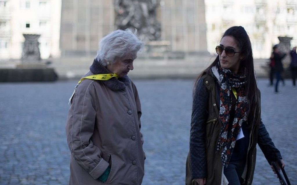 Renee Salt, 85, liberated from Bergen-Belsen, walking in Kraków with a member of the UK group. (Photo credit: Sam Churchill Photography)
