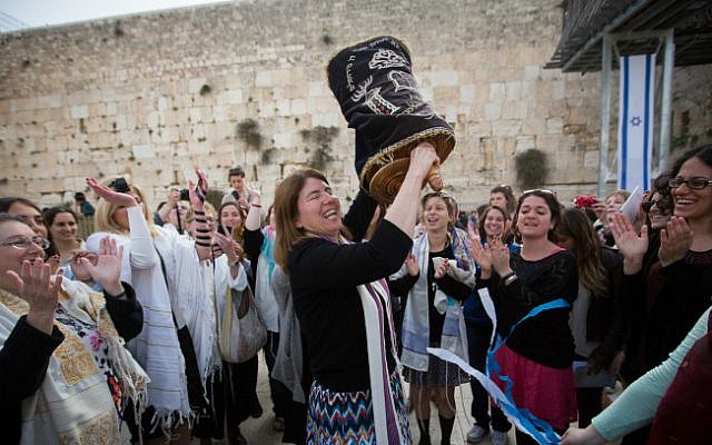 Illustrative photo of women dancing with a Torah scroll at the Western Wall, April 20, 2015. (Miriam Alster/Flash90)