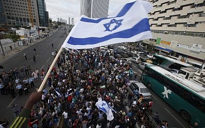 Israelis take part in a demonstration in Tel Aviv on May 3, 2015 against alleged police brutality and institutionalized discrimination against the Ethiopian community. (photo credit: AFP/JACK GUEZ)