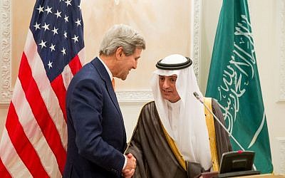 Newly appointed Saudi Minister of Foreign Affairs Adel al-Jubeir (right) shakes hands with US Secretary of State John Kerry during a joint press conference at the Riyadh Air Base in the Saudi capital, May 7, 2015. (photo credit: AFP/Andrew Harnik, Pool)